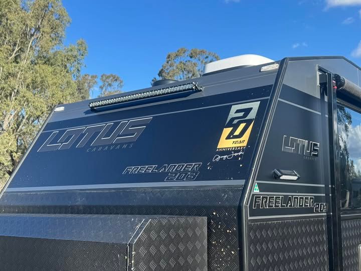 A row of lights on this lotus van tilted down to prevent whistling on tow 