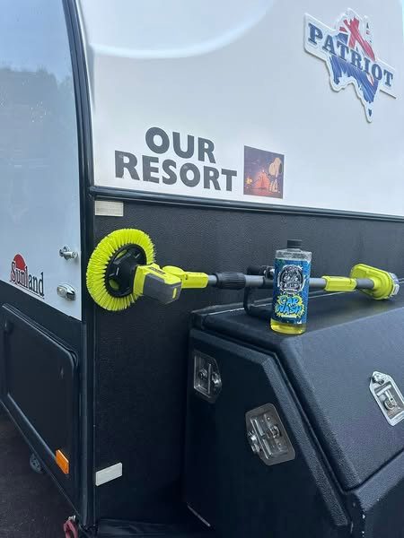 A ryobi power cleaner and bottle of car wash rests atop of a toolbox on this sunland patriot caravan