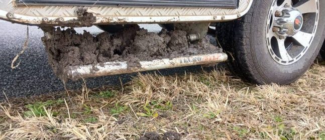 black mud on the step reveals just how close this caravan was to being bogged